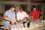 Carlo Galli, Marco Gianesini e Thomas Bardea versano lo spumante offerto dal vincitore della Coppa Valtellina Marco Gianesini